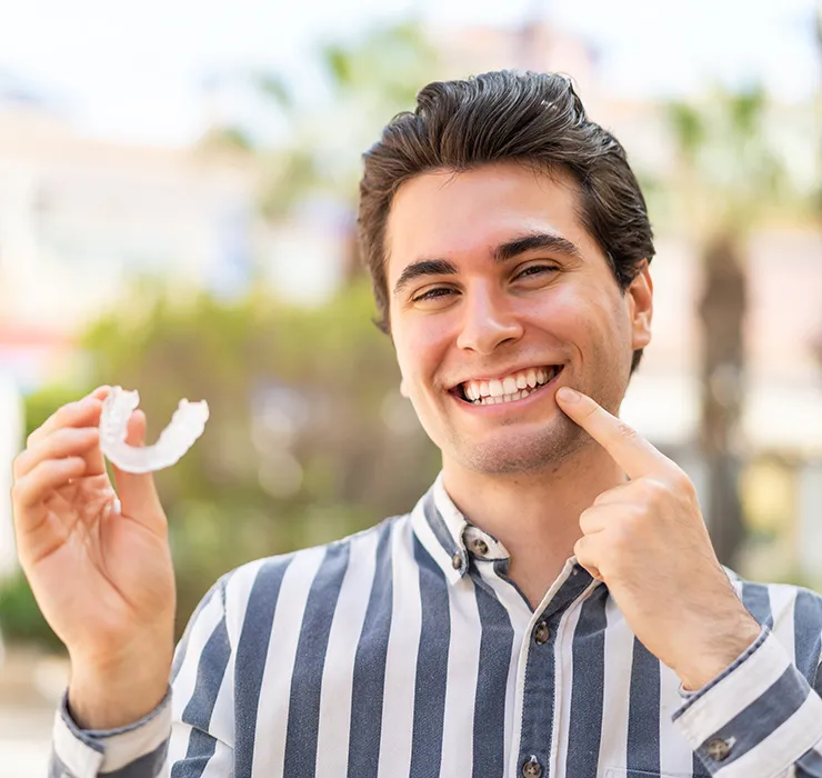 Man Smiling with Invisalign